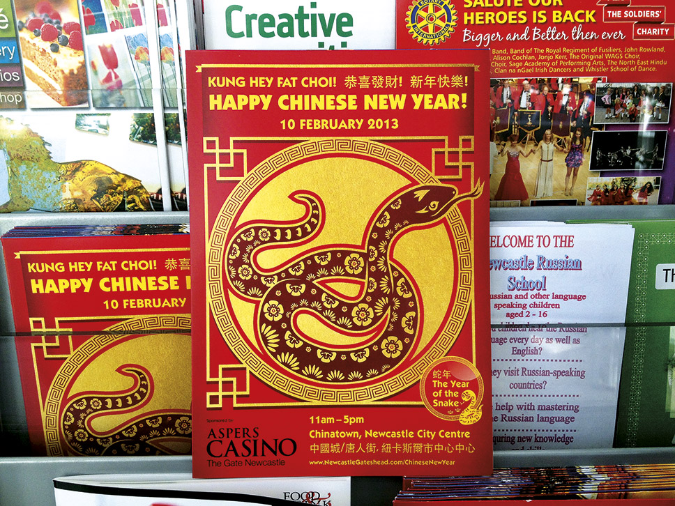 Chinese New Year brochure design on display in tourist information store