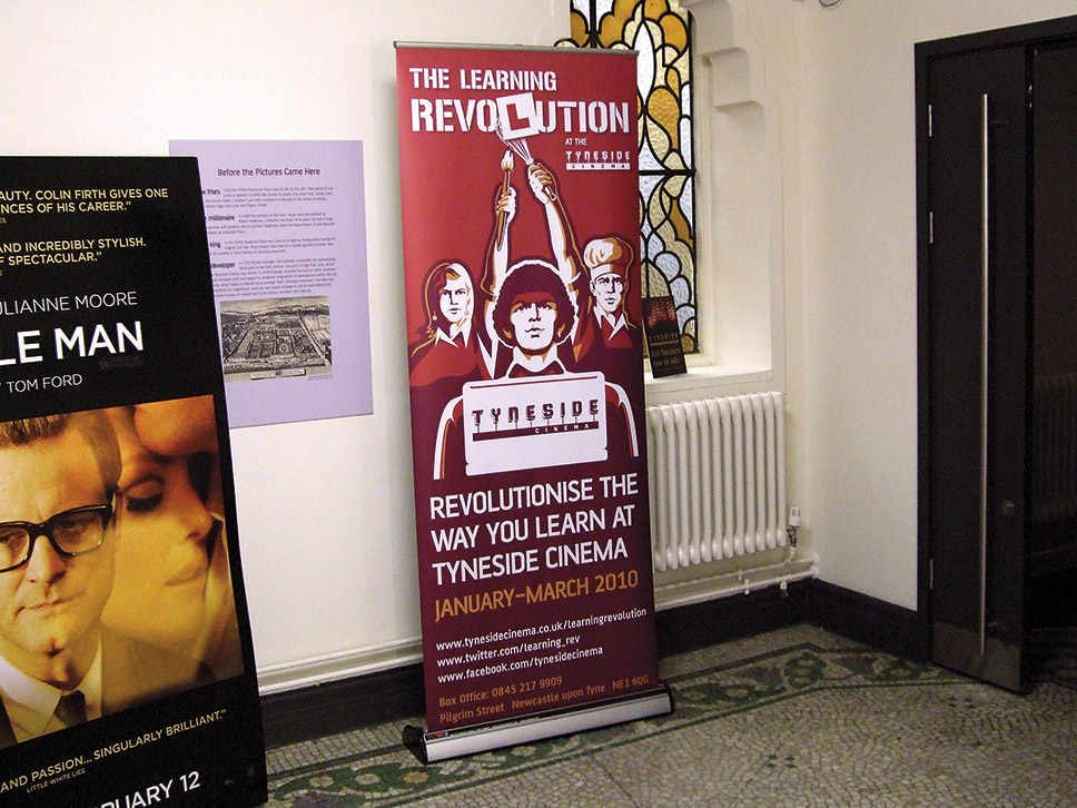 The Learning Revolution banner design displayed in cinema foyer