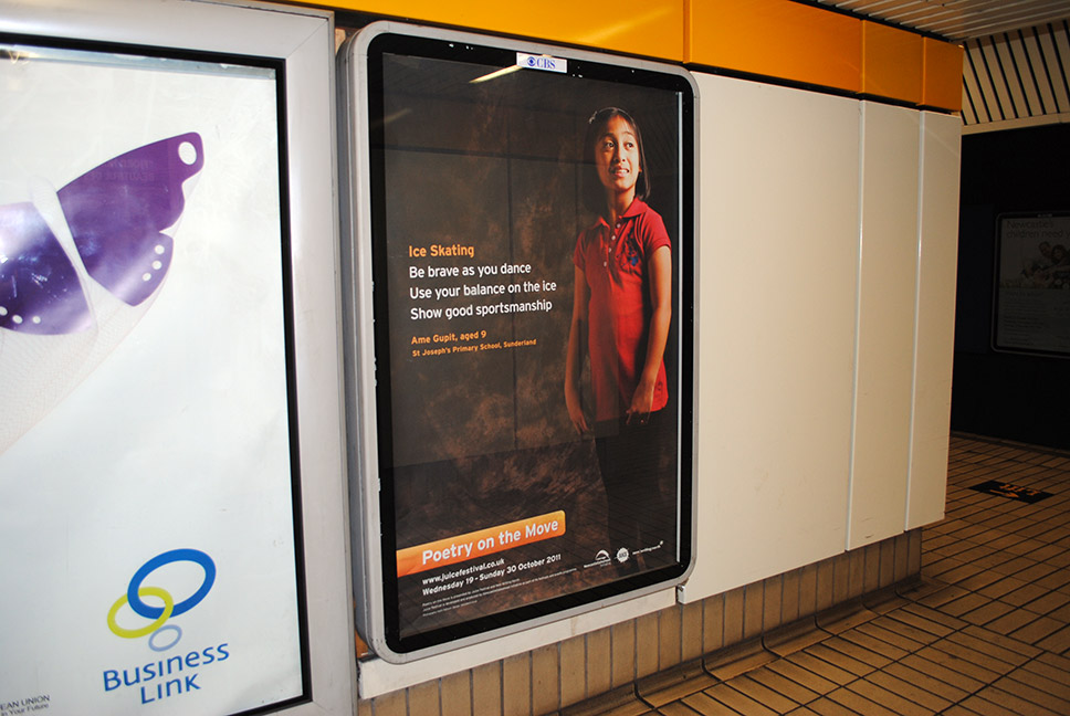 Poetry on the Move poster design on display in a Metro station